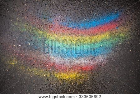 Colored Chalk On The Pavement. Children's Drawing On The Road.
