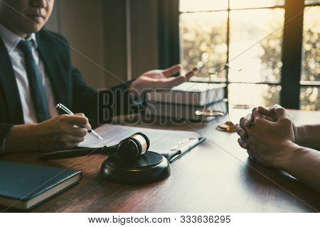 Lawyer Is Providing Information About The Client's Trial At The Lawyer Office.