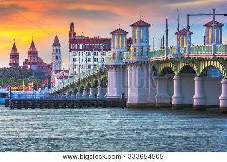 St. Augustine, Florida, USA city skyline and Bridge of Lions at dusk.
