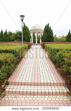 White Rotunda In Public Park In Yiwu City, Zhejiang Province, China. Green Clean Environment At Summ