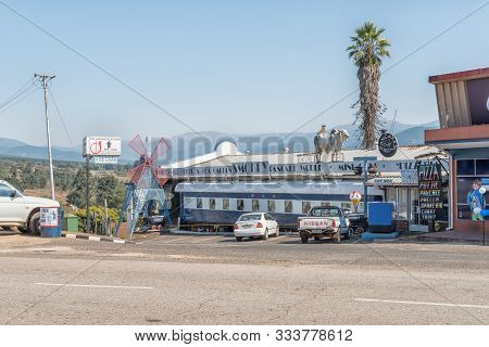 Sabie, South Africa - May 21, 2019: A Street Scene, With A Historic Railway Coach Incorporated Into 