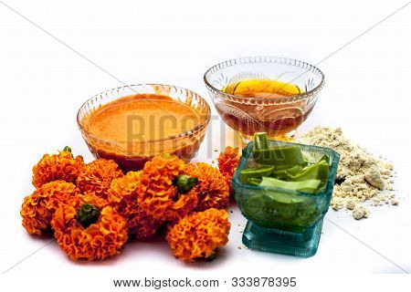 Marigold Face Mask For Sensitive Skin Isolated On White Consisting Of Some Honey, Marigold Flowers,