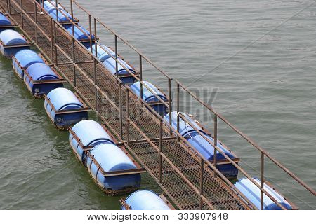 The Walkway Is A Buoy-type Bridge Floating On The Water Surface.
