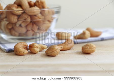 Cashew Nuts In A Cup And Placed On The Table.
