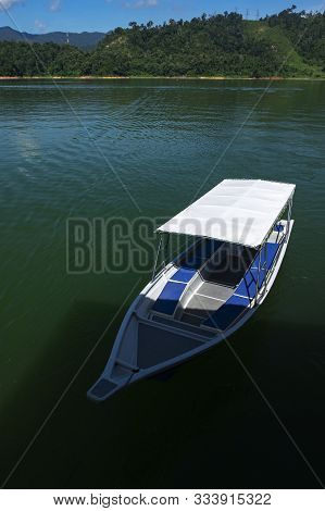 Fiber Speed Boat Floating Near The Boathouse.boat Is Main Transportation At Banding Lake Located In