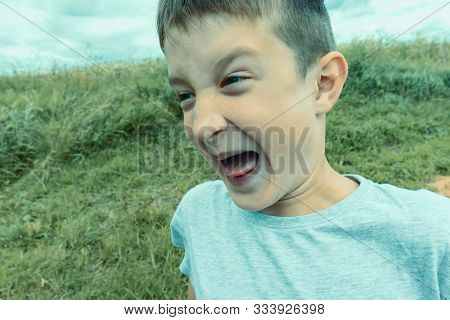 Angry Screaming Teenage Boy With Open Mouth Close Up, Deviant Behavior Concept