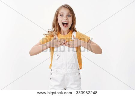 Excited Happy Smart Little Kid With Blond Hair Blue Eyes, Proudly Beating In Chest, Smiling Telling 