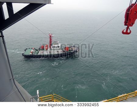 Tug Preparing To Assist Drillship For Sea Trials In South Korean Shipyard.