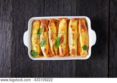 Blintz, Rolled Filled With Sweetened Cottage Cheese Pancakes Or Crepes In A Baking Dish On A Wooden 
