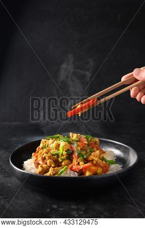 Traditional Thai Breakfast Gai Pad Pongali With Chicken, Eggs, Yellow Thai Curry Paste On Rice.