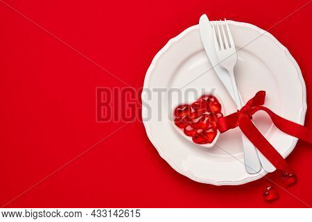 Valentines Day Background Or Concept With Empty Pink Plate And Whiteware On Scarlet Or Red Backgroun