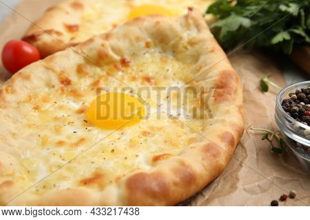 Fresh Delicious Adjarian Khachapuri On Parchment, Closeup