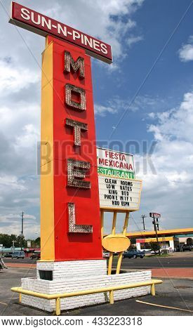 Lufkin, Tx - July 22: Sun N Pines Motel Sign With American Flag Located In Lufkin, Tx