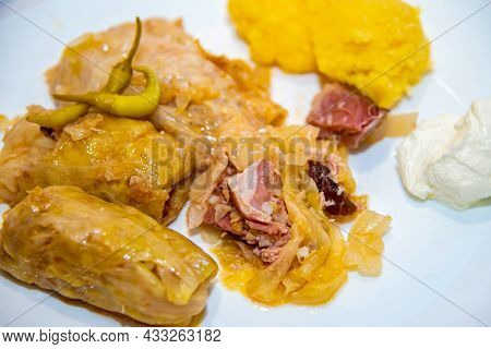 Sarmale With Polenta, Sour Cream, Ribs And Hot Peppers, In A Restaurant, Close Up View