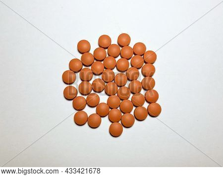 Ibuprofen To Reduce High Body Temperature. Ibuprofen Is Red On A White Isolated Background