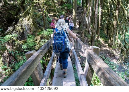 Washington, Usa - July 9, 2021: Very Crowded Hiking Trail Across A Footbridge To Marymere Falls Wate