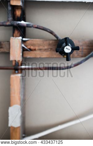 Laundry Room Renovation With Plaser Walls Interior Exposed With Visible Electricity Wires And Copper