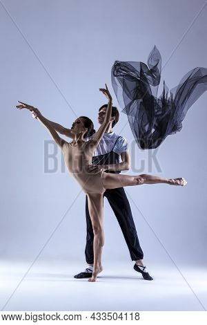 Dance Photography. Professional Ballet Dance Couple Performing Together In Studio While Girl Posing