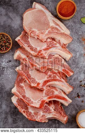 Fresh Pork Meat Bone In On Background. Top View.