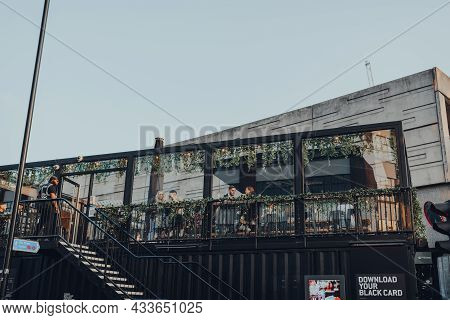 London, Uk - September 03, 2021: View From The Street Of People At The Roof Cafe At Boxpark Shoredit