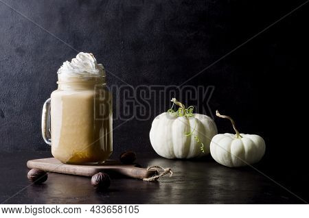 Delicious Pumpkin Drink Latte With Milk Foam On A Black Background