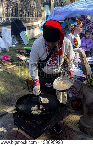 Korosten' Ukraine - September 04 2021: Festival Of Potato Pancakes In The City Park. A Colorful Man 