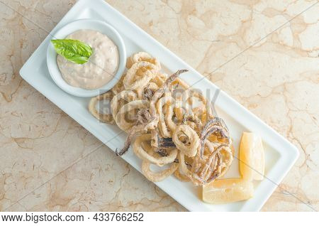 Fried Squid Whit Lemon Appetizer From A Top View
