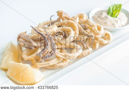 Fried Squid Whit Lemon Appetizer In High Key