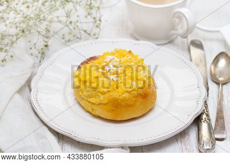Traditional Portuguese Bread Pao De Deus On White Dish On Wooden Background