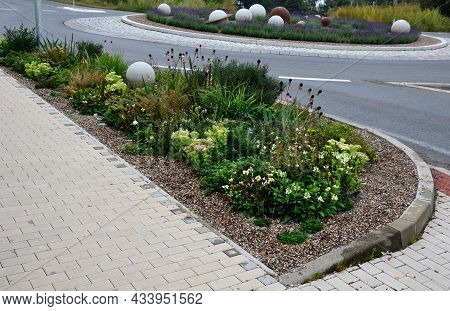 Roundabout With A Lavender Bed In Which There Are White Large Balls Of Smooth Concrete. Diode-correc
