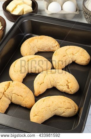 Chipas, Typical South American Cheese Bun On A Baking Tray With Ingredients.