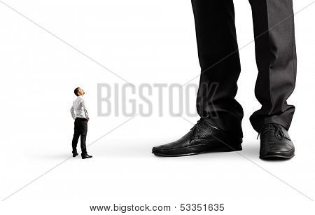 small businessman looking at his big boss. isolated on white background