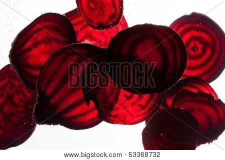 close up of sliced raw beet in water