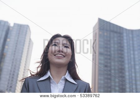 Portrait of young businesswoman outdoors
