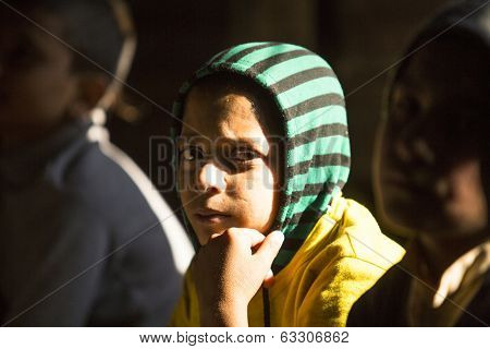 KATHMANDU, NEPAL - DEC 9, 2013: Unknown child in lesson at Jagadguru School. School established at 2013, to let new generation learn Sanskrit and preserve Hindu culture.