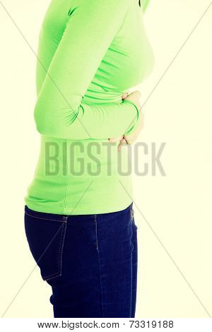 Young woman with stomach issues,isolated on white