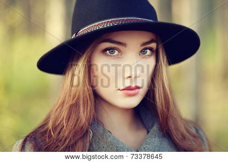 Portrait Of Young Beautiful Woman In Autumn Coat