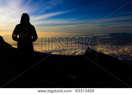 Female Hiker On Top Of Mountain For Sunrise Or Sunset