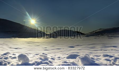 Sun rays and snow in winter