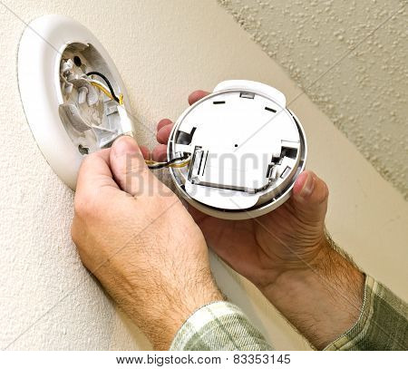 Smoke Detector Being Repaired