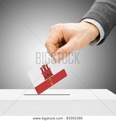 Voting Concept - Male Inserting Flag Into Ballot Box - Gibraltar