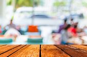 Empty Wood Table And Coffee Shop Blur Background With Bokeh Image