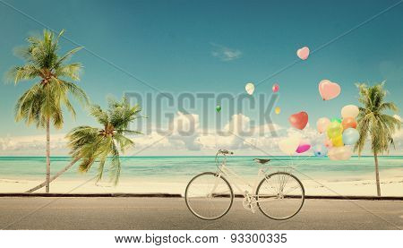bicycle vintage with heart balloon on beach
