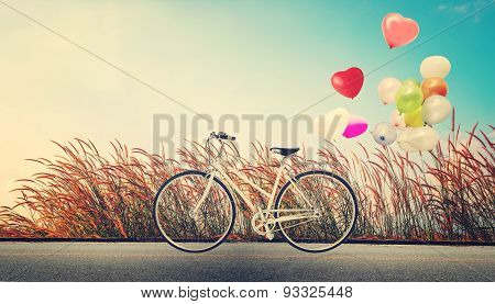 bicycle vintage with heart balloon