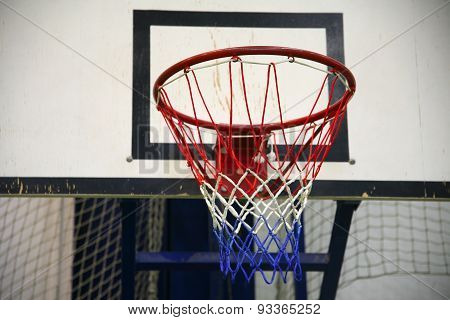 Basketball Hoop In A High School Gym