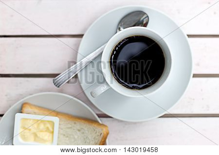 Coffee cup top view on wooden table background