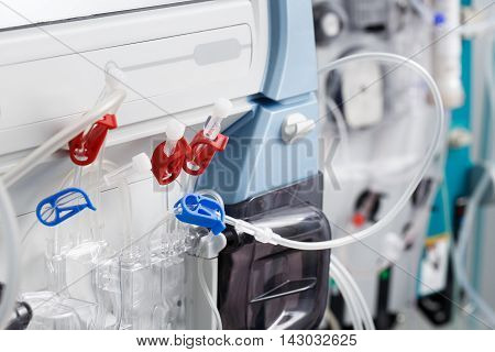Hemodialysis bloodline tubes connected to hemodialysis machine. Health care blood purification kidney failure transplantation medical equipment concept.