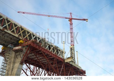 ST. PETERSBURG, RUSSIA - FEBRUARY 17, 2016: The crane on the construction of the Central section of Western high-speed diameter, february day. Saint Petersburg