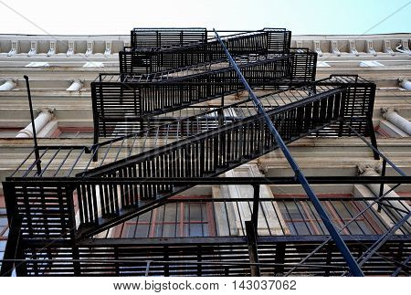 Fire escape on the wall of old brick building