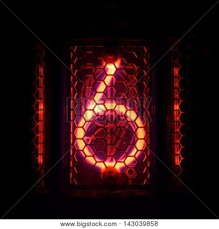 The real Nixie tube indicator of the numbers of retro style. Indicator glow with a magical purple fringing. Digit 6